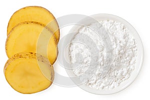 Potato starch in a white ceramic bowl next to slices of raw potato with skin isolated on white from above
