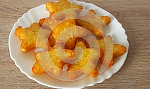 Potato starlets on a white plate