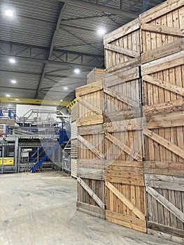 Potato storage facility. Forklift used to stack the crates. Refrigerated cold warehouse for potatoes and onions with wooden boxes.