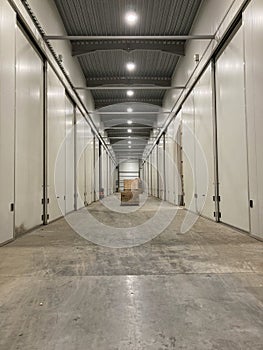 Potato storage facility. Refrigerated cold warehouse for potatoes and onions with wooden boxes.