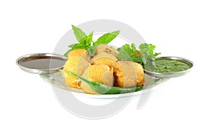 Potato vada pakoda or fritter indian food snack in pure white background