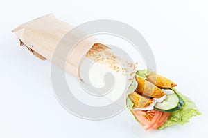 Tasty lavash rolls with potato and vegetables, isolated on white. menu photo