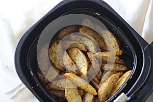 Potato wedges inside air fryer. Best way to fry potatoes without oil