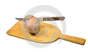 A potatoe cutted half with a knife