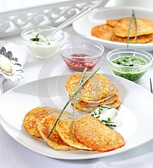 Potatoe pancakes with three dips photo