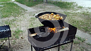 Potatoes baked in a cast iron cauldron