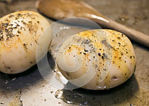 Potatoes, basted, seasoned.