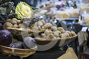 Potatoes and cabbage in baskets on the Borough market in London