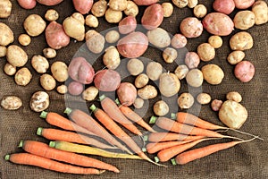 Potatoes and carrots raw vegetables food for pattern texture and background