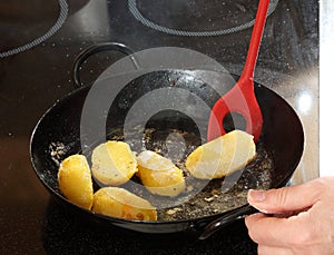 Potatoes cooking in a pan