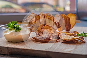 Potatoes cut into slices, on a stick