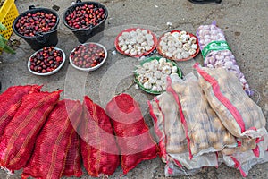 Potatoes, garlic, and dates for sale at the souk in Sinaw, Oman