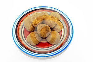 Potatoes on multicoloured plate