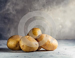 Potatoes on neutral gray background
