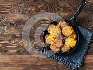 Potatoes pancakes or flapjacks on wooden table