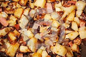 Potatoes and sausages called Tiroler GrÃ¶stl, in a hot pan