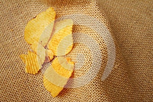 Potatoes sheet on background of brown wooden