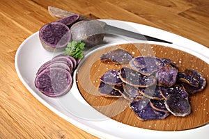 Potatoes variety `Bleue d`Artois` cut in slices