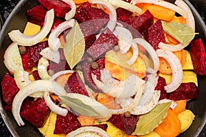 potatoes with vegetables in a pan ready for stewing