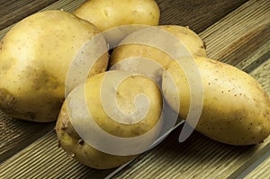 Potatos on wood place