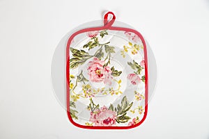 Potholder for hot dishes with white flowers and red border