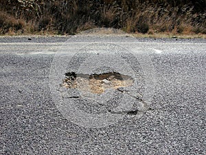 Pothole in Bitumen on Country Road in Australia