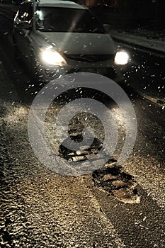 Potholes at night photo