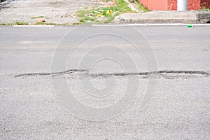 Potholes at the road that can damage a car