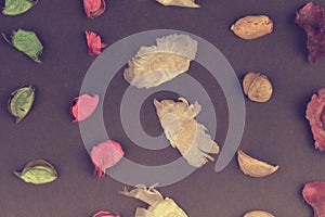 Potpourri on a black background. Flavored potpourri leaves. Dry potpourri leaves close-up. Geometric pattern. Closeup.