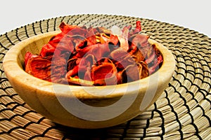 Potpourri of dry flowers in a wooden bowl. For aromatherapy and welness concept