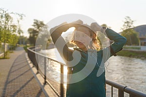 Potrait of attractive young woman preparing for her early morning exercise.