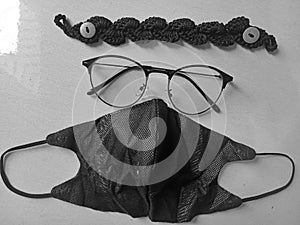 A potrait black and white face mask, mask conector and eyeglass for woman photo