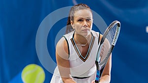 Potrait of Female Tennis Player Holding the Racquet During Championship Match, Ready to Receive Ball