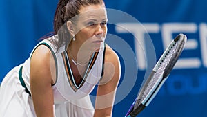 Potrait of Female Tennis Player Holding the Racquet During Championship Match, Ready to Receive Ball