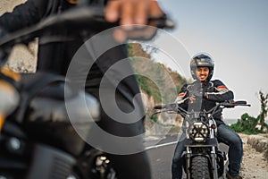 potrait indonesian man riding motorbike outdoors
