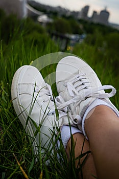 Potrait of white shoes in the grass