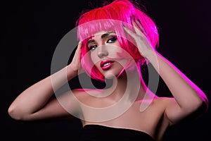 Potrait of young woman with pink hair