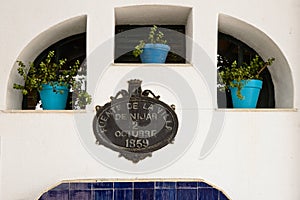 Pots with flowers in the fountain of NÃ­jar, Almeria, Spain