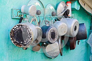 Pots, pans, lids and pots on the wall