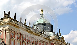 POTSDAM, GERMANY. A fragment of the New palace with a dome against the background of the sky. Park of San Sushi