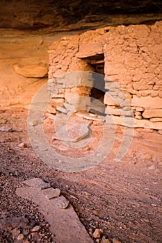 Potsherds on rock near entrance of pueblo dwelling