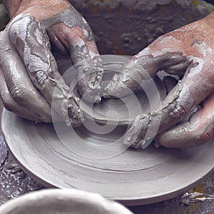 Potter hands wheel pottery