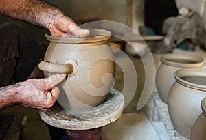 The potter make pot from clay