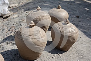 Potter makes earthen lamps or â€˜diyasâ€™ ahead of the forthcoming Diwali festival