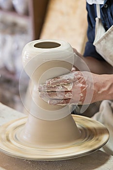 Potter makes pottery handmade in workshop