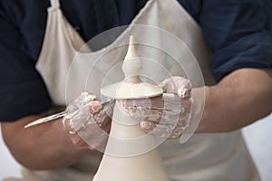 Potter makes pottery handmade in workshop