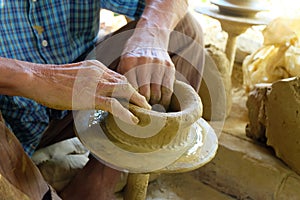 potter making clay pots.