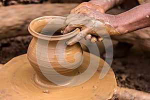 Potter making earthen pot