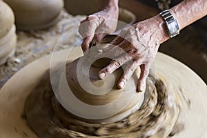 Potter modeling a clay bowl in Hoi An Vietnam