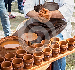Potter`s hands shaping up the clay